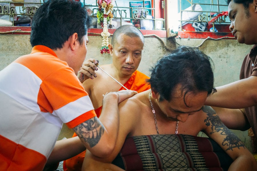 Thai Monk performing Tattoo